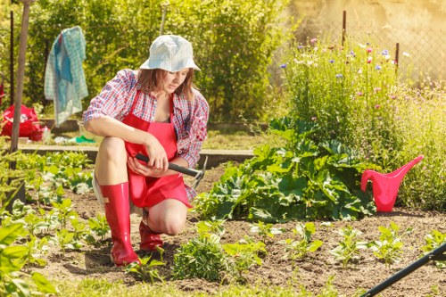 Gardeners World Team members working together in a lush garden